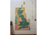 Slow Ways Great Britain walking network displayed vertically on a wall, with island insets above.